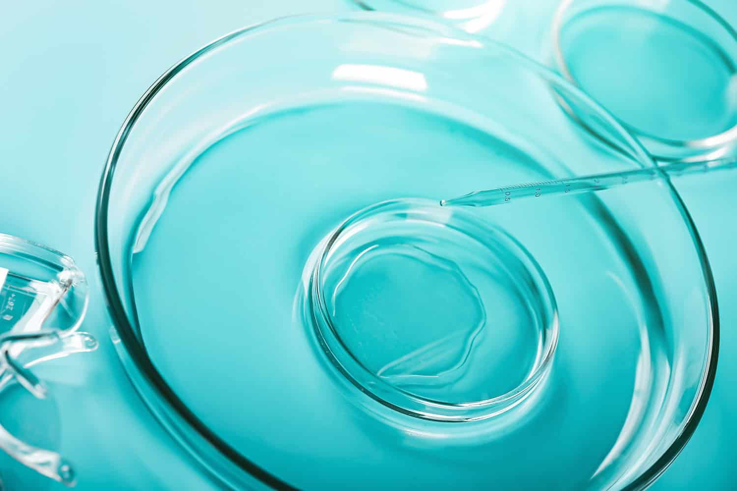 Medical abstract background. Petri dishes and glass pipette.