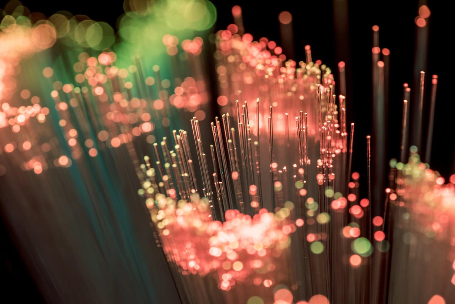 Close up of shiny pink fiber optics texture background