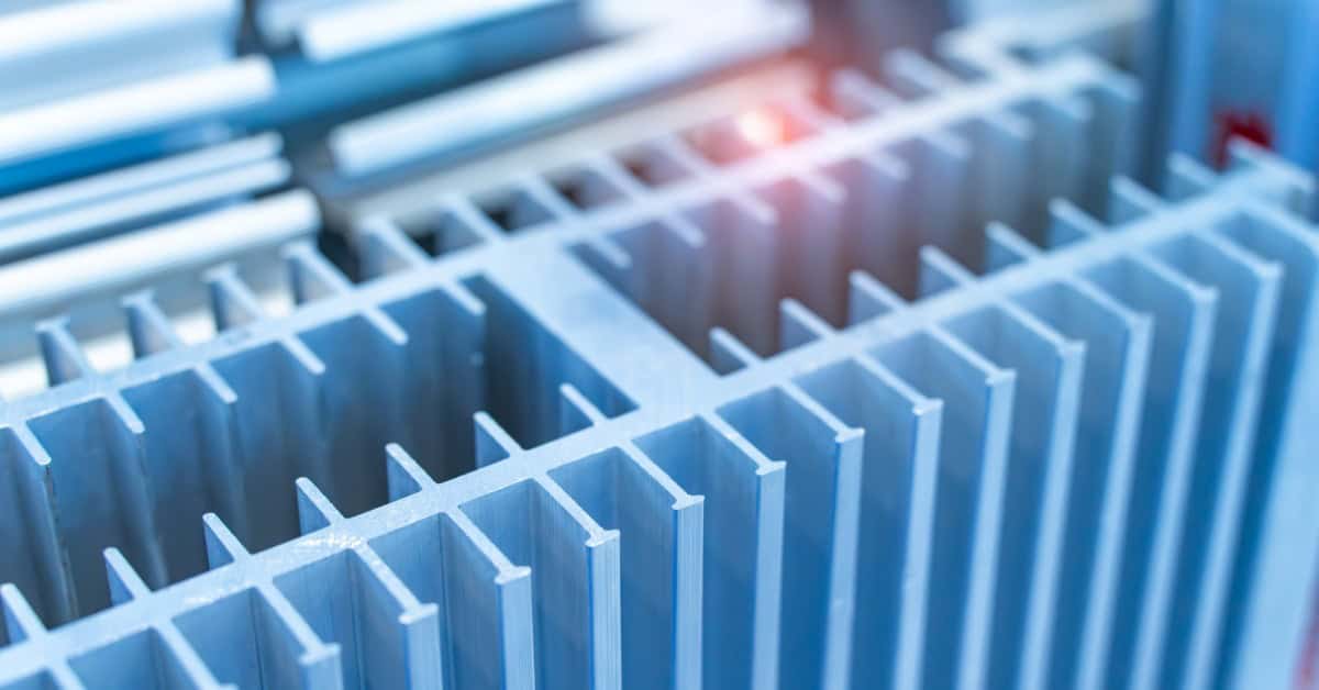 A close-up view shows alumina plates that are attached together with more alumina plates. The background is blurry.